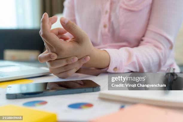 wrist pain from excessive computer typing - neuropathy stock pictures, royalty-free photos & images