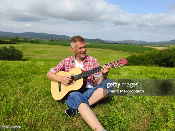 men's mental health - plucking an instrument stock pictures, royalty-free photos & images