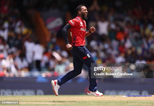 Chris Jordan of England celebrates the wicket of Saurabh Netravalkar of USA to complete a hat trick during the ICC Men's T20 Cricket World Cup West...