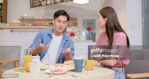 couple have conflict in restaurant - annoying boyfriend stock pictures, royalty-free photos & images