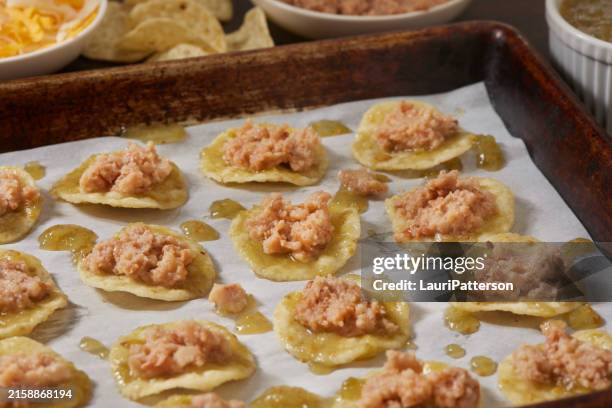 preparing bite size taco appetizer's - salsa verde stock pictures, royalty-free photos & images