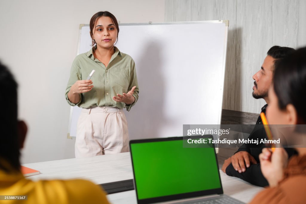 Group of colleagues engaged in a group discussion.