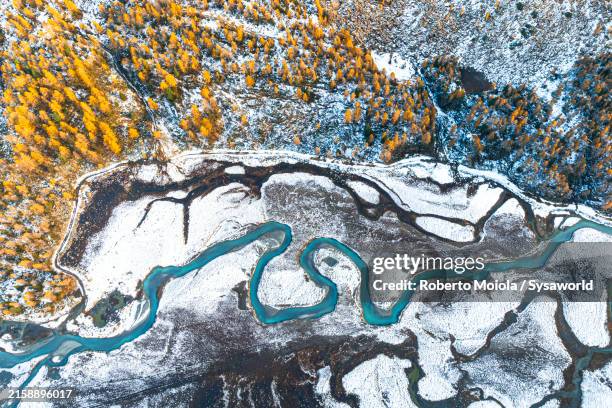 winding river among snowy mountains in autumn - mountain ridge stock pictures, royalty-free photos & images