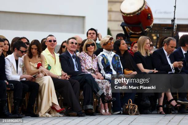 Tom Sturridge, Alexa Chung, Alexis Roche, John Galliano, Anna Wintour, Pharrell Williams, Helen Williams, Delphine Arnault and Xavier Niel during...