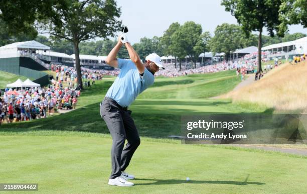 Scottie Scheffler of the United States plays his shot from the 18th tee during the first playoff hole during the final round of the Travelers...