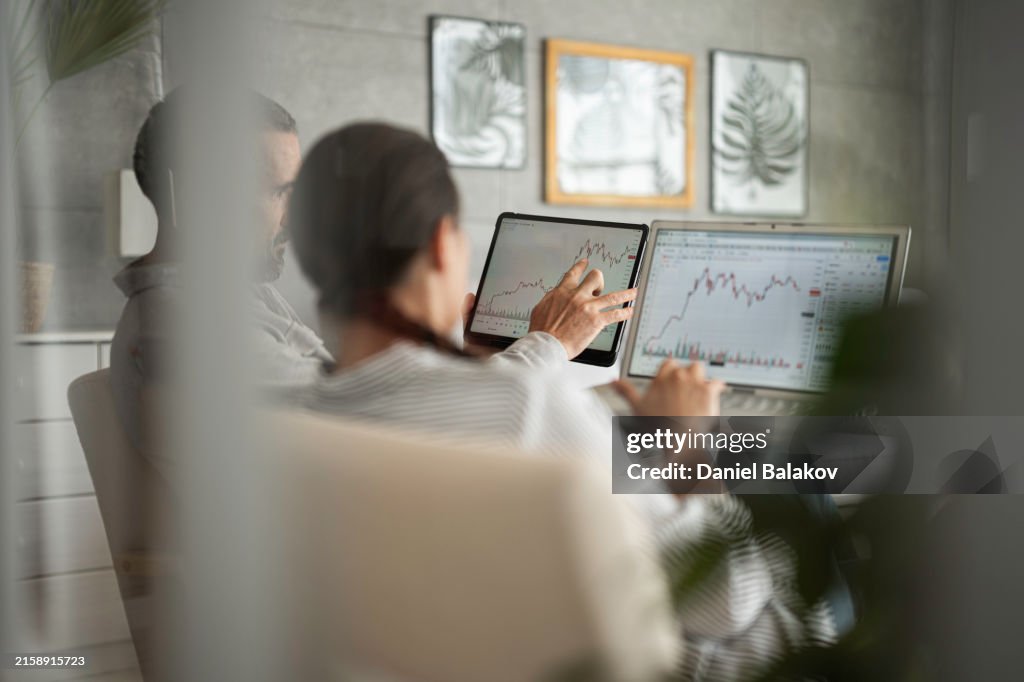 Investing in Stocks. Couple Trading Together.