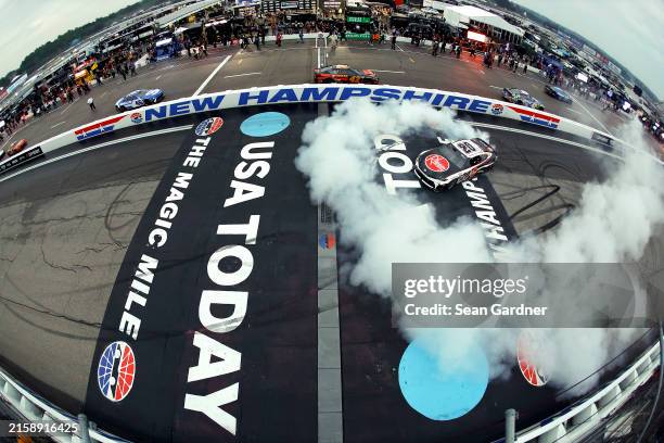 Christopher Bell, driver of the Rheem Toyota, celebrates with a burnout after winning the NASCAR Cup Series USA Today 301 at New Hampshire Motor...