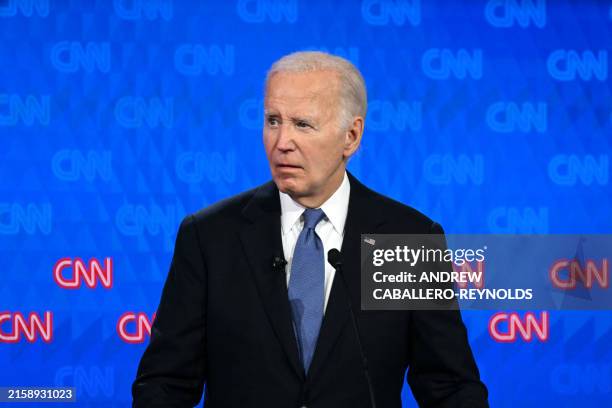 President Joe Biden looks on as he participates in the first presidential debate of the 2024 elections with former US President and Republican...