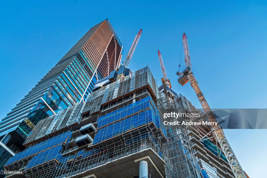 Luxury apartment construction, office buildings, blue sky