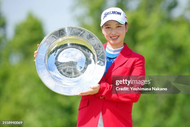 Sakura Koiwai of Japan poses with the trophy after winning the tournament following the final round of Earth Mondahmin Cup at Camellia Hills Country...