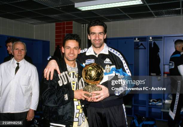 Juventus player Michelangelo Rampulla and Roberto Baggio with the Golden ball in dressing room on 1993, in Turin, Italy.