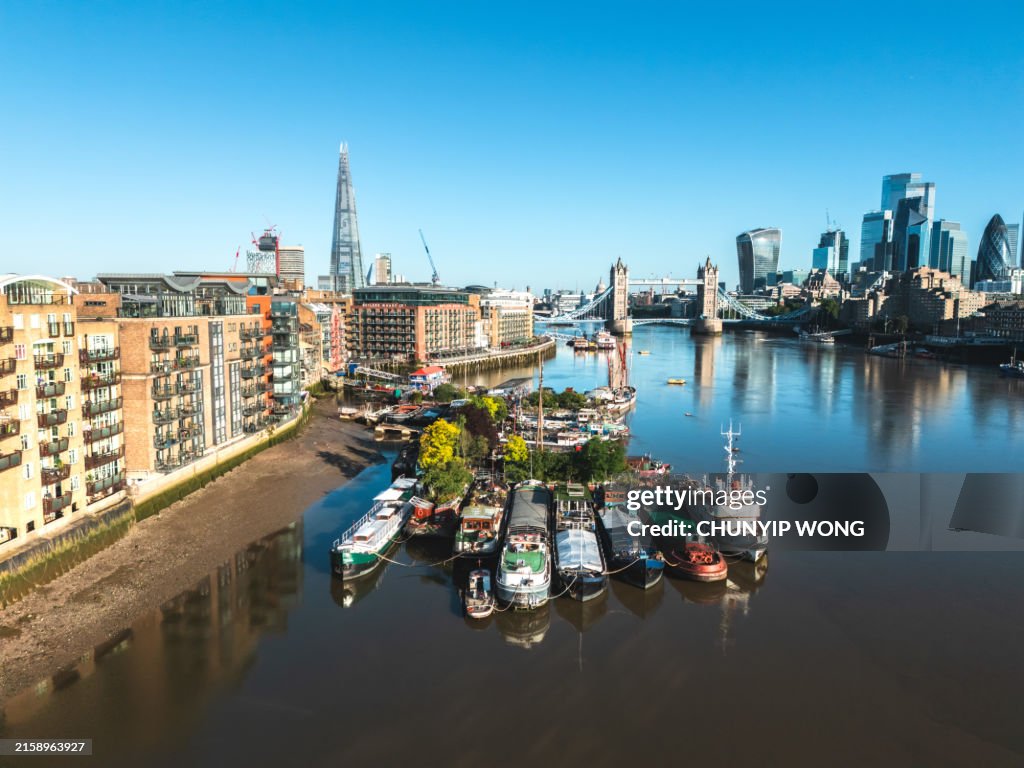 Boats moored near Tower Bridge on the River Thames in London