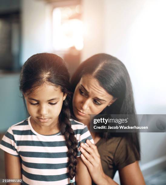 Mother, girl child and sad with comfort for mistake in house, depression or fear in apartment. Mom, daughter and calm empathy in home for childhood fail, together with support or kindness for adhd