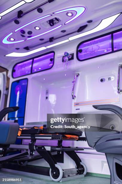 empty ambulance stretcher waiting for patient inside modern emergency vehicle - openbare dienstverlening stockfoto's en -beelden