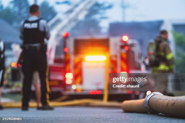 house fire - police firefighter stock pictures, royalty-free photos & images