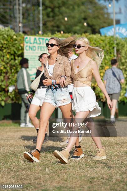 Cara Delevingne and Anya Taylor-Joy attend day one of the Glastonbury Festival on June 28, 2024 in Glastonbury, England.