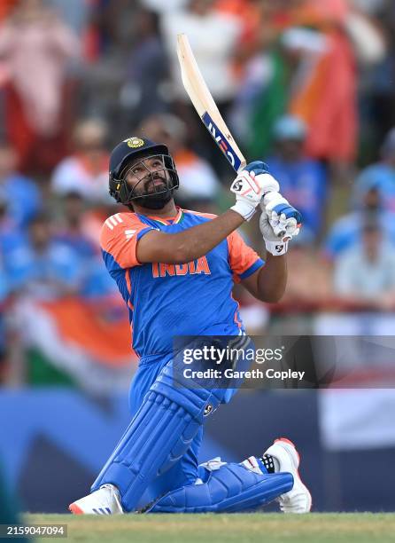 India captain Rohit Sharma hits six runs during the ICC Men's T20 Cricket World Cup West Indies & USA 2024 Super Eight match between Australia and...