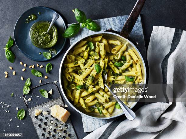 penne pasta with pesto - pasta stock pictures, royalty-free photos & images