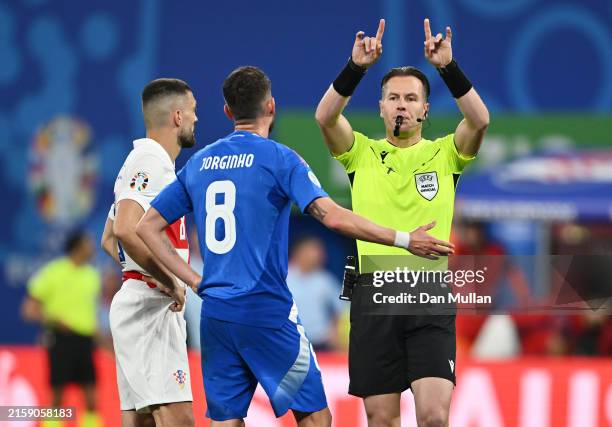 Jorginho of Italy reacts as Referee Danny Makkelie gestures to indicate a VAR review after a potential penalty incident as of Davide Frattesi of...