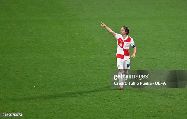 Luka Modric of Croatia celebrates scoring his team's first goal during the UEFA EURO 2024 group stage match between Croatia and Italy at Football...