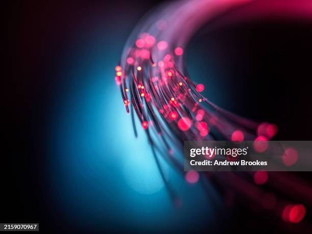 fibre optics carrying data through the internet - cable stock pictures, royalty-free photos & images