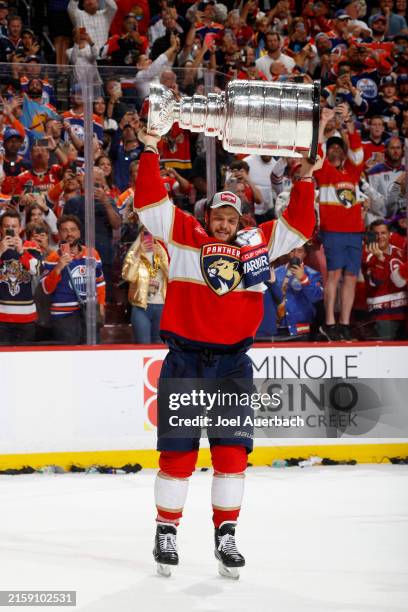 Aleksander Barkov of the Florida Panthers lifts the Stanley Cup after Florida's 2-1 victory against the Edmonton Oilers in Game Seven of the 2024...