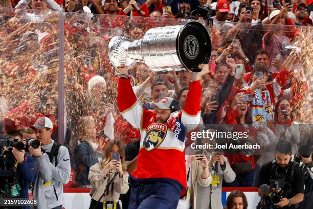 Aleksander Barkov of the Florida Panthers lifts the Stanley Cup after Florida's 2-1 victory against the Edmonton Oilers in Game Seven of the 2024...