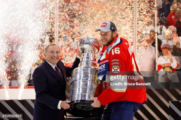 Commissioner Gary Bettman and Aleksander Barkov of the Florida Panthers hold the Stanley Cup after Florida's 2-1 victory against the Edmonton Oilers...