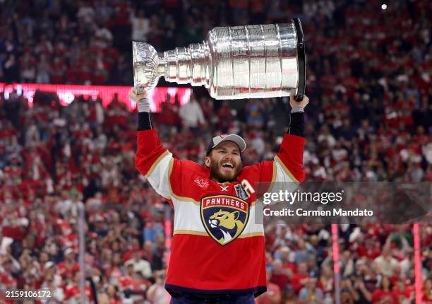 Matthew Tkachuk of the Florida Panthers lifts the Stanley Cup after Florida's 2-1 victory against the Edmonton Oilers in Game Seven of the 2024...