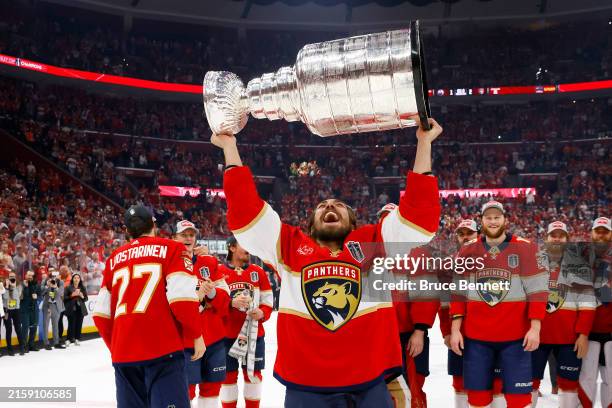 Ryan Lomberg of the Florida Panthers yells while lifting the Stanley Cup after Florida's 2-1 victory against the Edmonton Oilers in Game Seven of the...