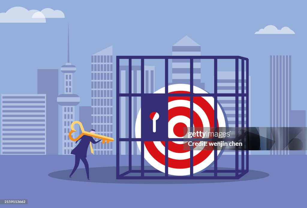 Target Locked In Business Man Uses A Key To Open The Target Locked In A Cage High-Res ...