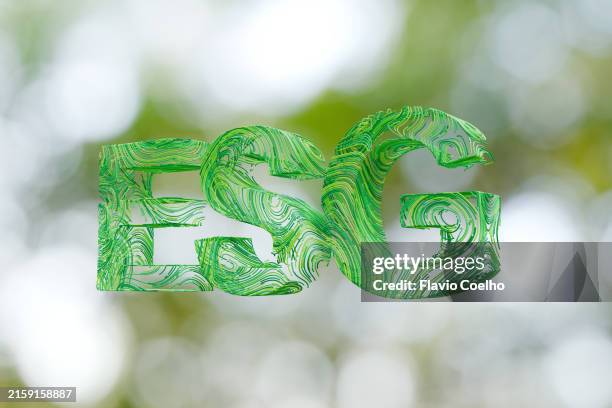 esg letters on defocused green background - emerald green stock pictures, royalty-free photos & images