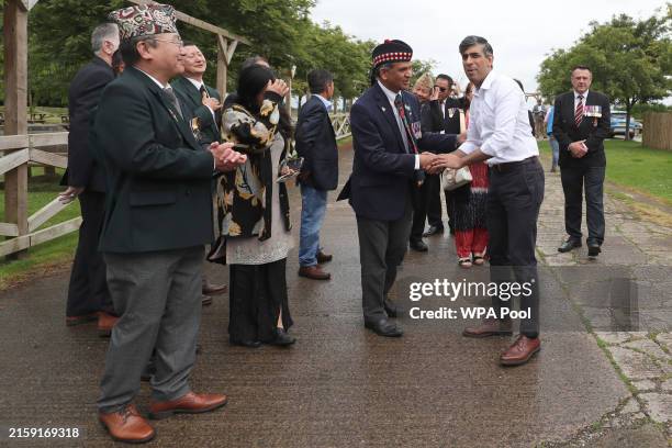 Britain's Prime Minister Rishi Sunak meets armed forces veterans at a cafe on Armed Forces Day in his Richmond and Northallerton constituency on June...