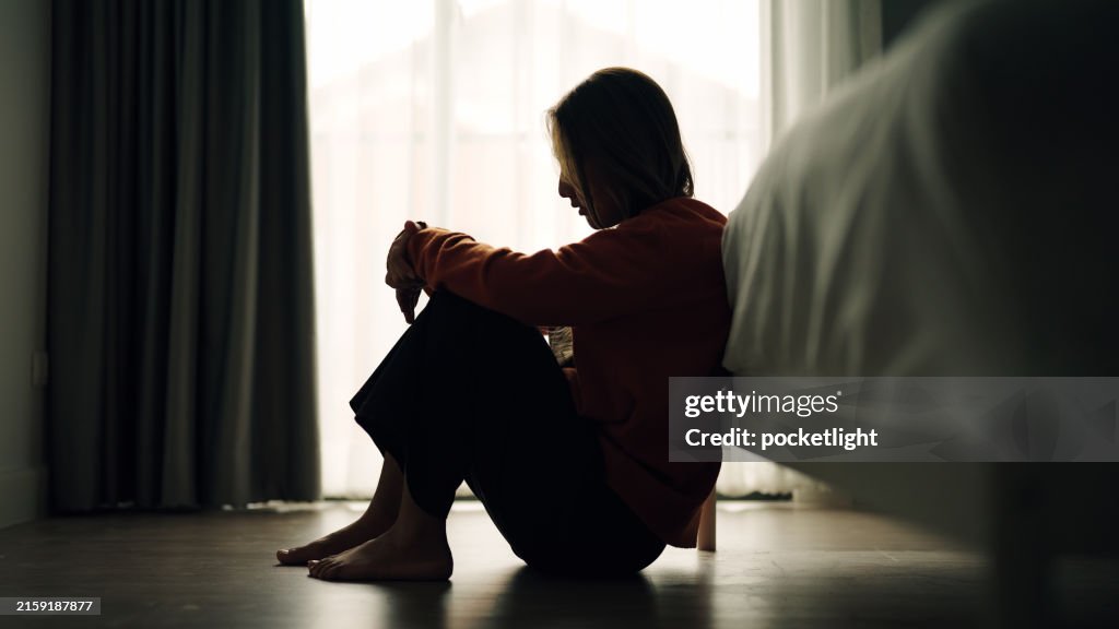 Woman depression in bedroom.
