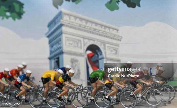 Vintage miniatures of Tour de France cyclists on display in a shop window, on June 18 2024, in Bayeux, Normandy, France