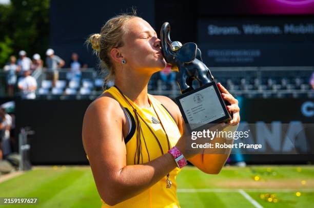 Diana Shnaider poses with the champions trophy after defeating Donna Vekic of Croatia in the singles final on Day 7 of the Bad Homburg Open on June...