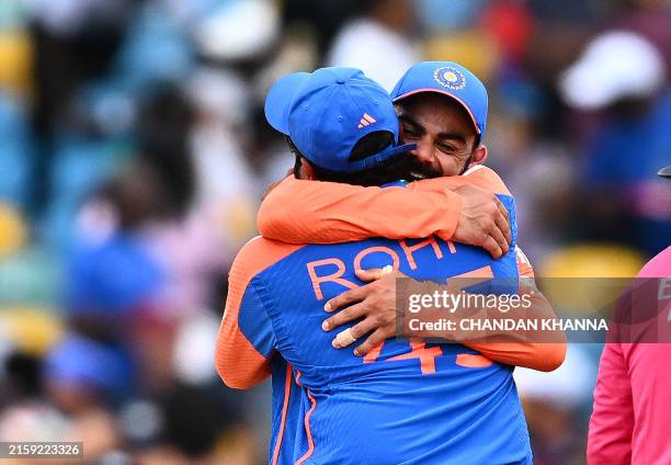 India's captain Rohit Sharma and Virat Kohli celebrate after winning ICC men's Twenty20 World Cup 2024 final cricket match between India and South...