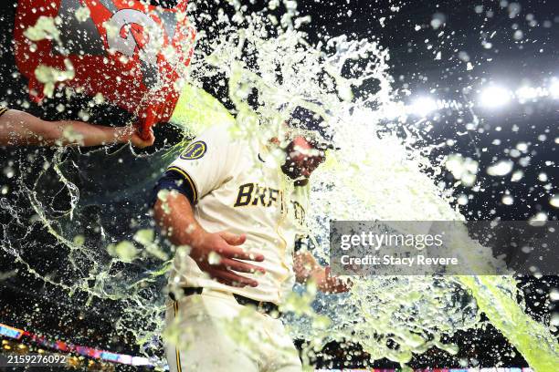 Bryse Wilson of the Milwaukee Brewers is doused by Willy Adames following a 3-1 victory over the Texas Rangers at American Family Field on June 25,...
