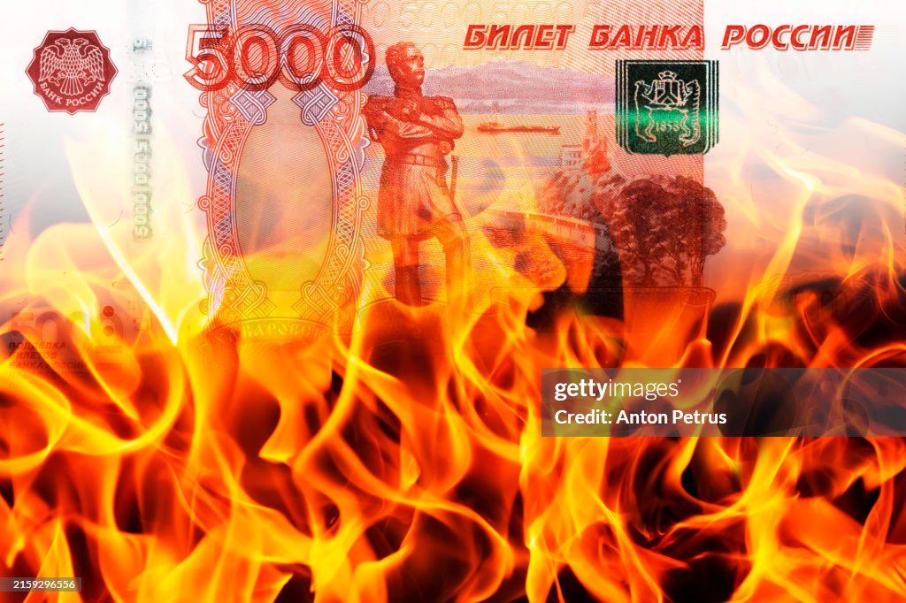 Banknote of Russian rubles on a background of flames