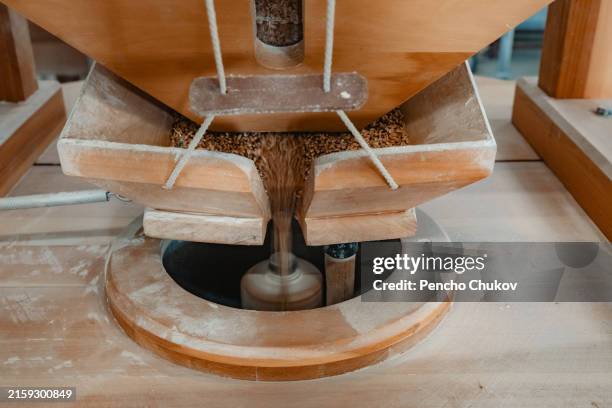 wooden flour grinding machine. authentic flour mill - staple stock pictures, royalty-free photos & images