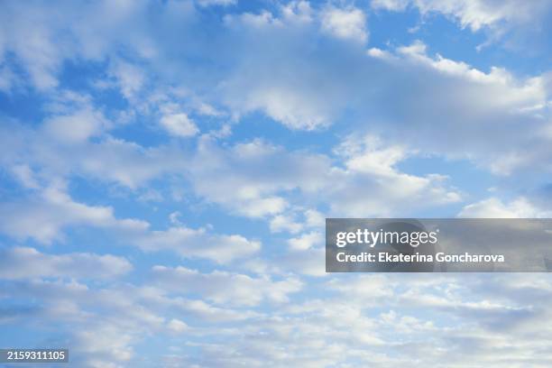 partly cloudy sky with blue and white clouds. soft and serene sky. - overcast stock pictures, royalty-free photos & images