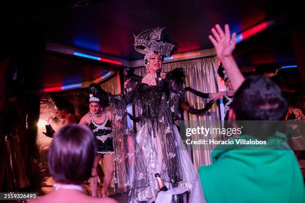 Spectators applaud at a performance in the drag queen show at "Finalmente Club", the iconic venue for the LGBTQIA+ community in Portugal on June 25...