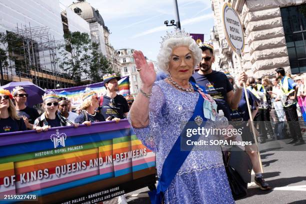 Performer dressed up as Queen Elizabeth II is seen waving her hand during the Pride Parade. Pride Parade 2024 involved a huge march through London....