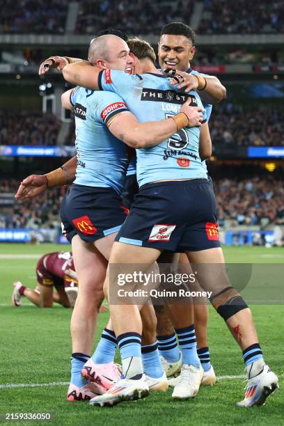 Dylan Edwards of the Blues celebrates scoring a try during game two of the men's State of Origin series between New South Wales Blues and Queensland...