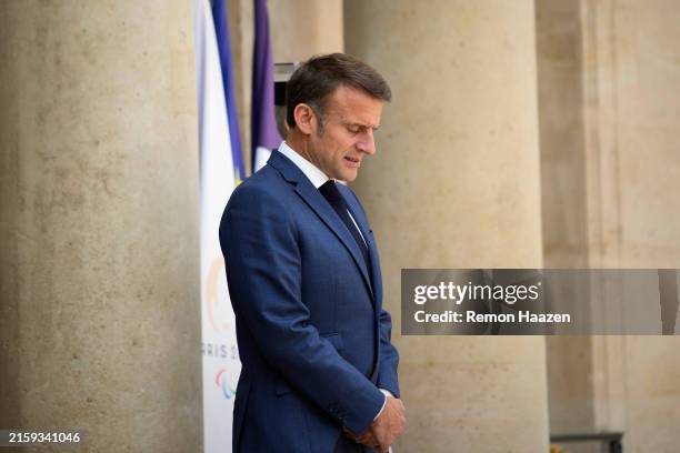 French President Emmanuel Macron waits for Hungarian Prime Minister Viktor Orbanto to arrive for a meeting at Elysee Palace on June 26, 2024 in...