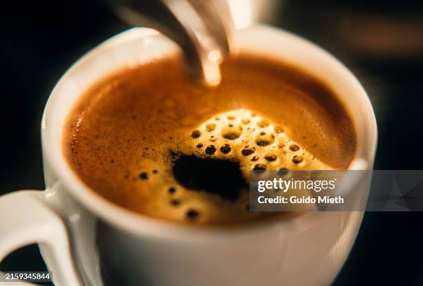 cup of fresh espresso out of a espresso machine. - coffee bildbanksfoton och bilder