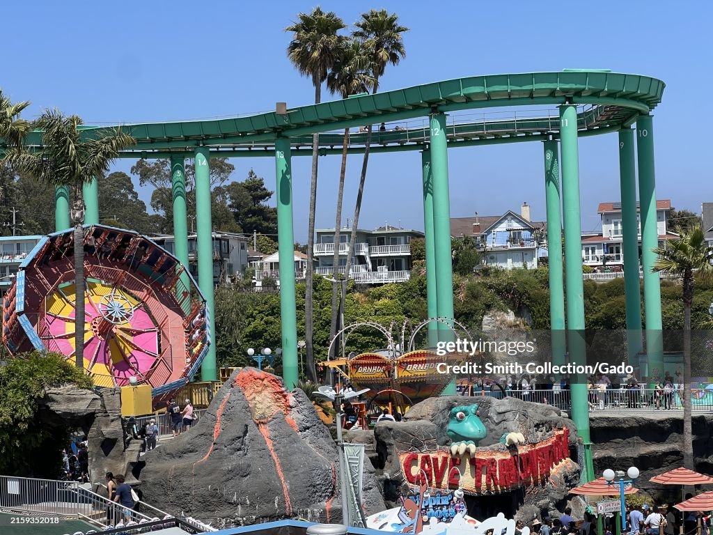 Visitors enjoying the rides and attractions at the Santa Cruz Beach ...