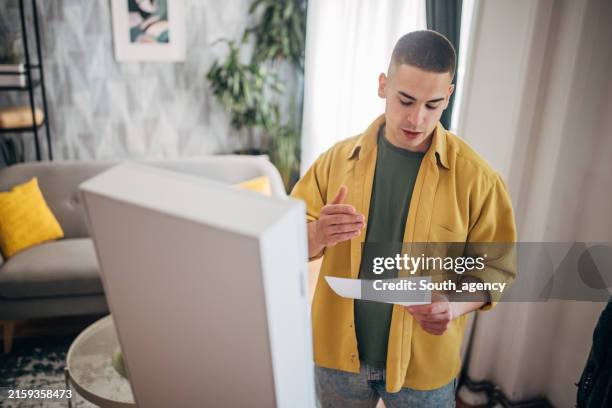 young white man preparing his speech in front of a mirror - rehearsal stock pictures, royalty-free photos & images
