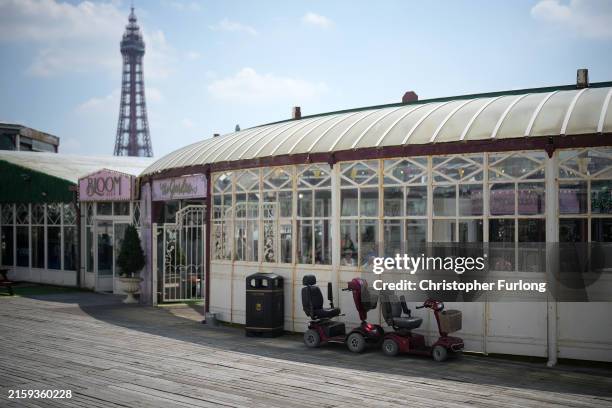 People enjoy the warm temperatures and sunshine on the north pier on June 26, 2024 in Blackpool, United Kingdom. Brits are enjoying warmer...