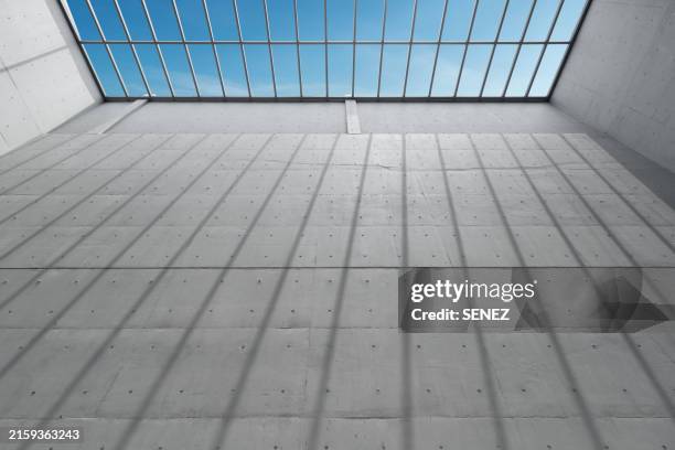low angle view of building against blue sky - samenhang stockfoto's en -beelden